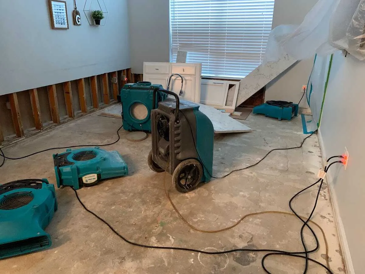 Dehumidifier in flood-cut room for Water Damage Restoration in Ames
